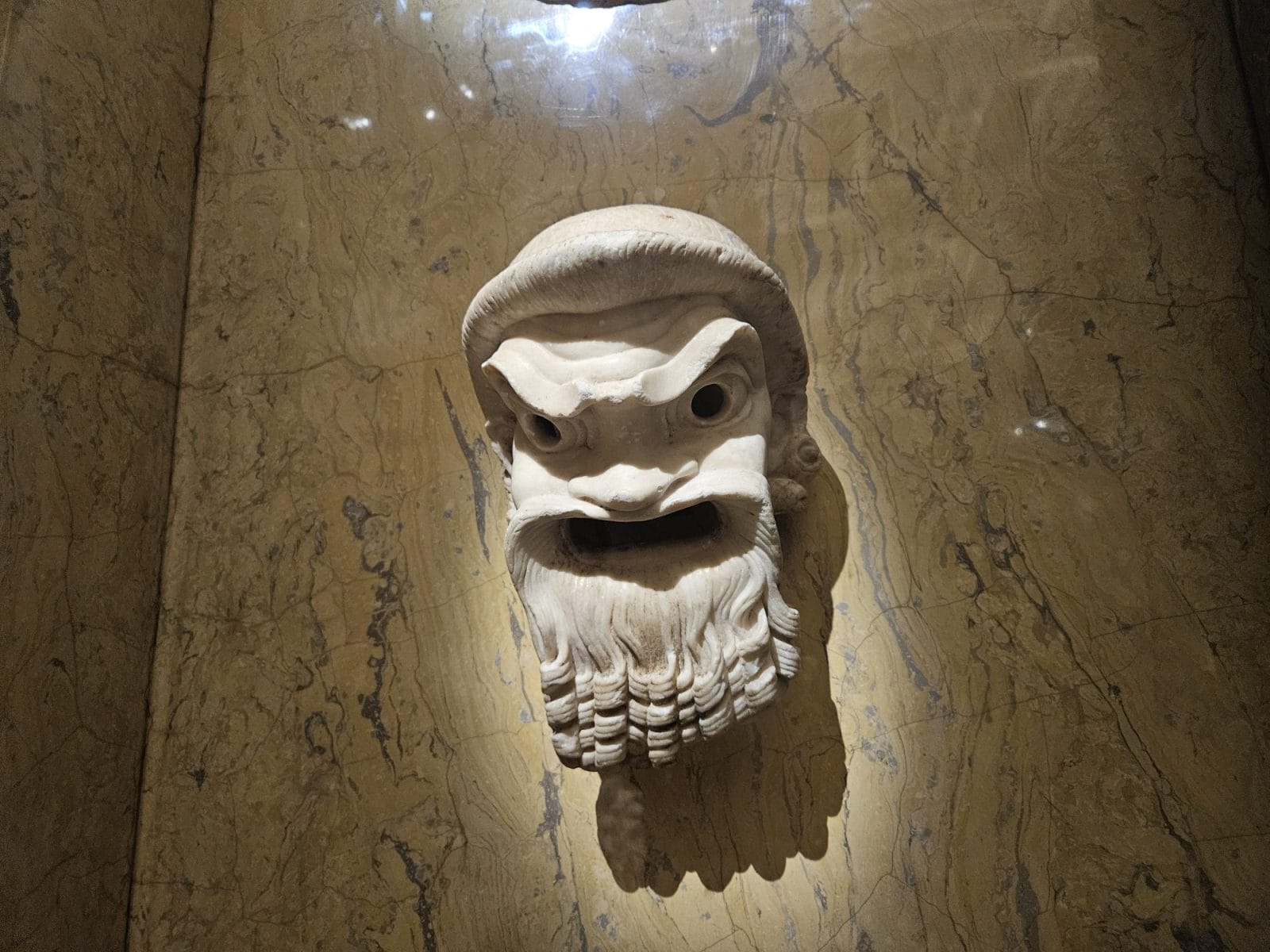 Roman marble comedy mask, specifically depicting a zornigen (angry) old man
